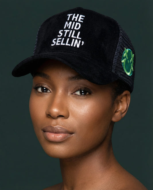 The Mid Still Sellin' Trucker Hat