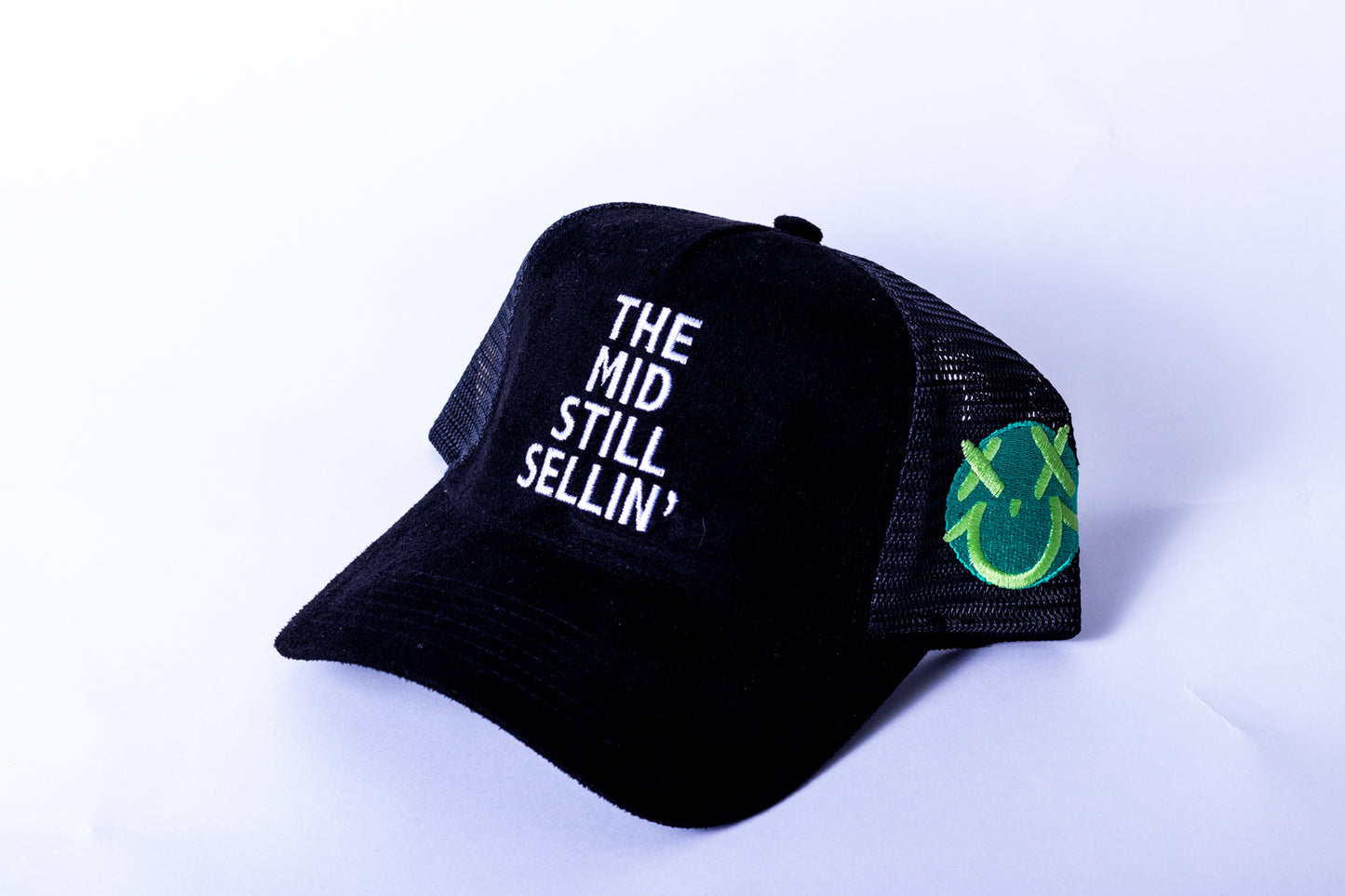 The Mid Still Sellin' Trucker Hat